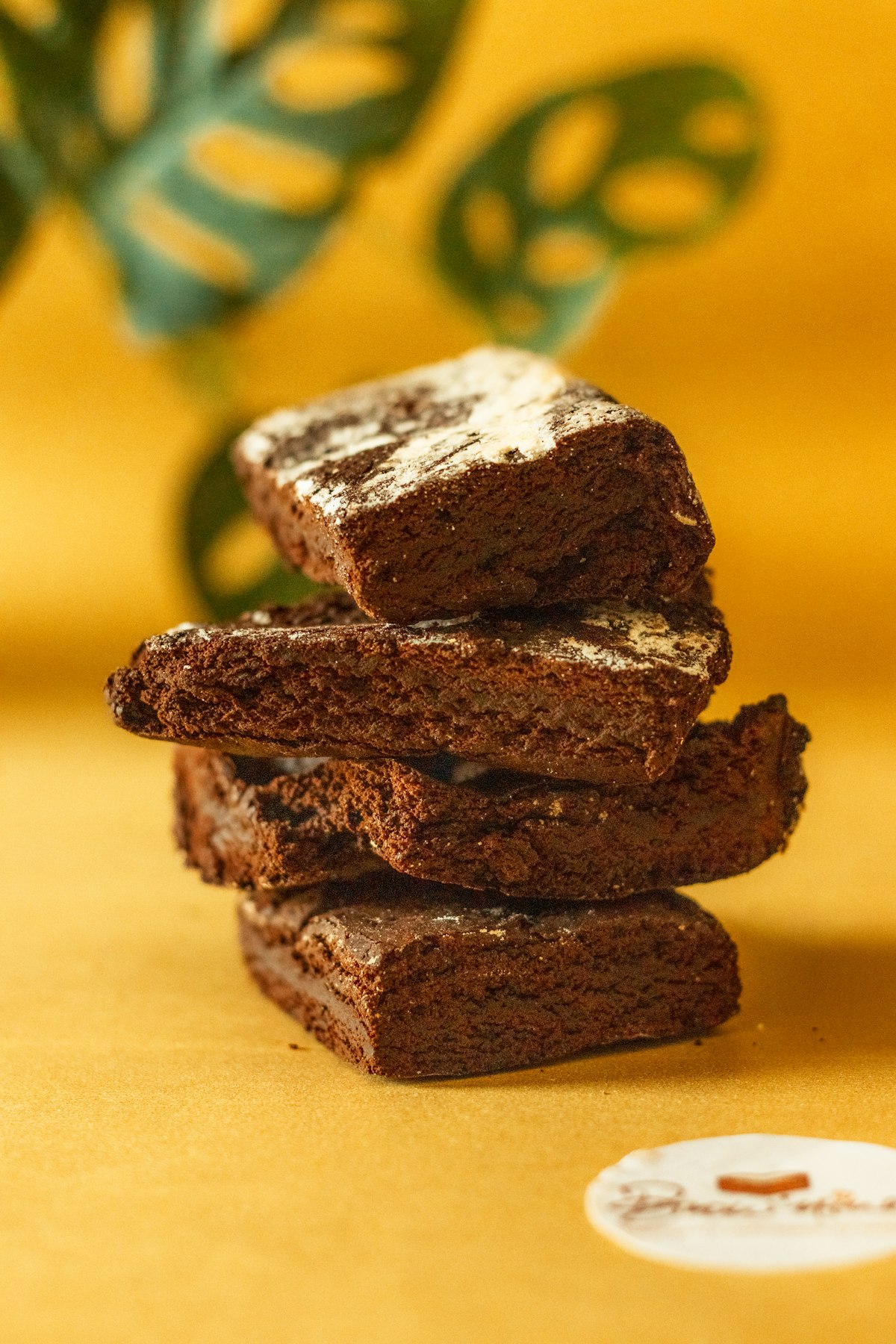 Stacked squares of triple chocolate brownie